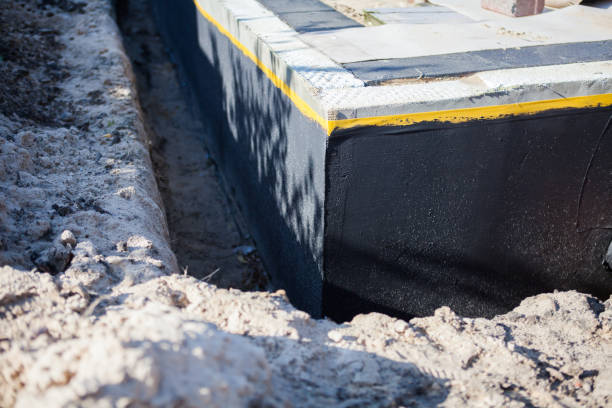 Professional Waterproofing technician working in Covington, VA